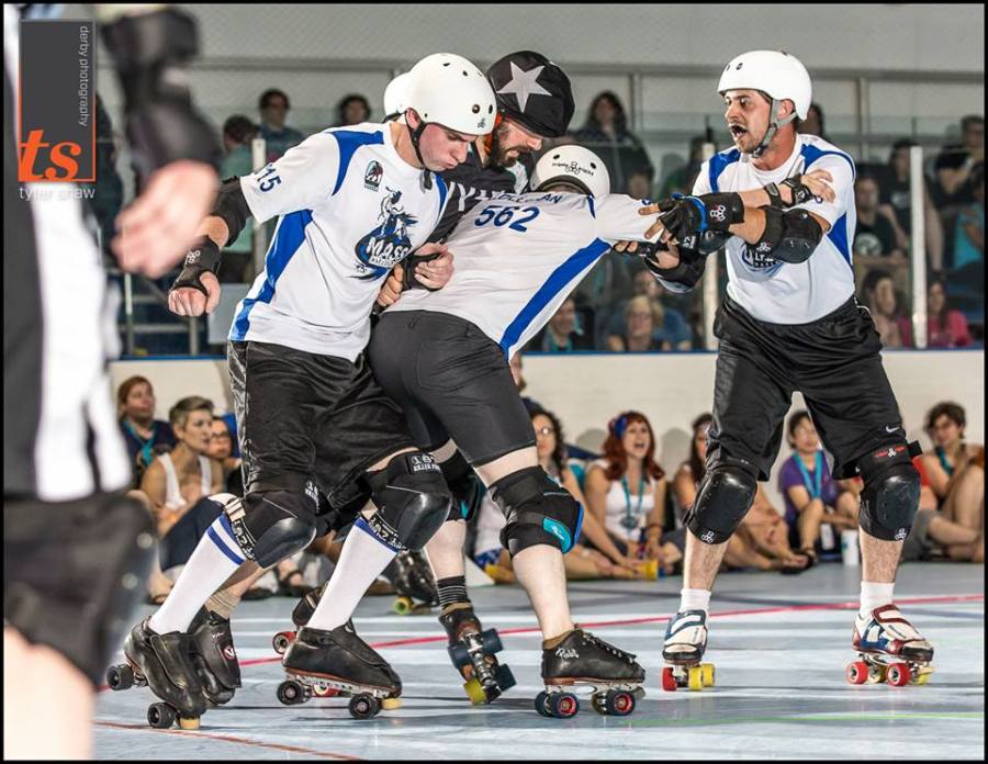 Mars Travolta, Colleran, and Keith Webb work in unison to hold back NYSE at ECDX. Photo by Tyler Shaw - Prints Charming Derby Photography